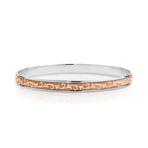 <p>Two-tone Machine Engraved Bangle. Rose gold on Sterling Silver.</p>