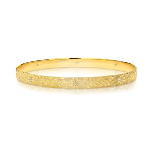 <p>Solid bangle, half round profile. Machine engraved Floral pattern with 8 x .02ct diamonds, Total diamond weight 0.16ct Approx. 1.25mm thick.</p>