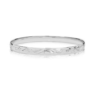 Solid bangle, half round profile. Hand engraved pattern. Approx 1.1mm thick, 9ct approx weight 13.5gms, 65mm diameter